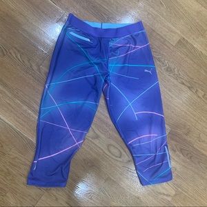 Bright neon colored Puma work out cropped pants
